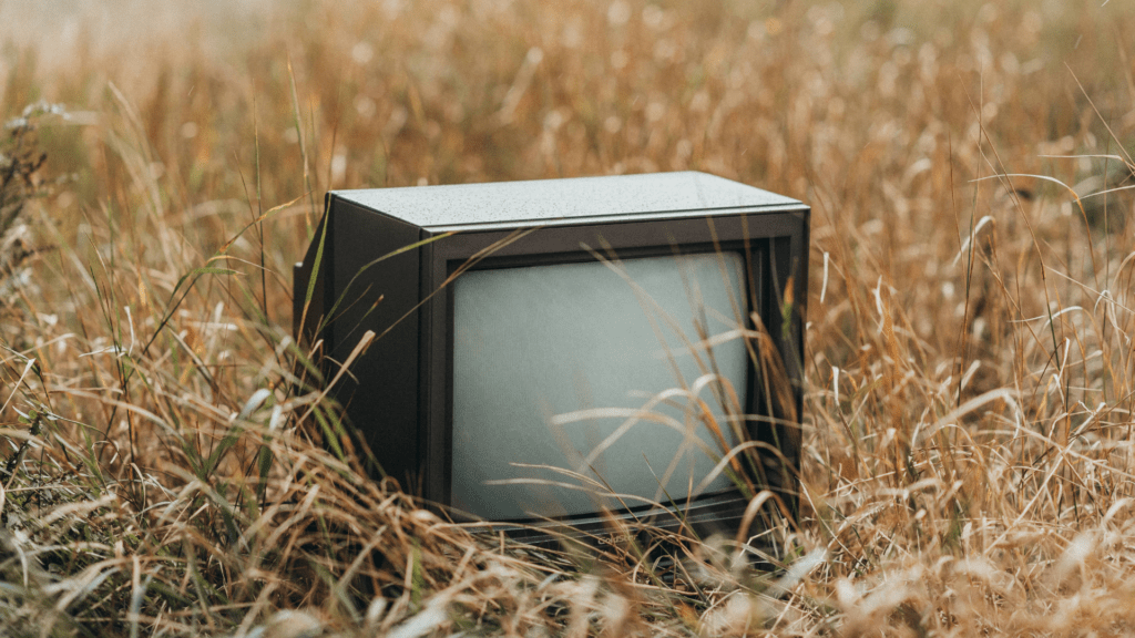 Old TV set in a wheat-field. Ocean Generation is sharing facts about the rise of e-waste, the environmental impacts, and what we can do about it.